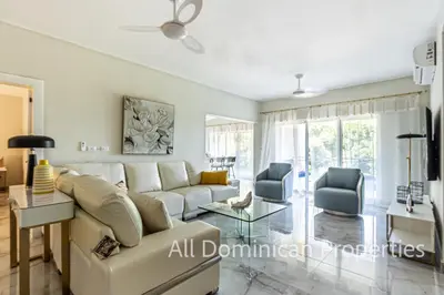 a living room with a couch and two chairs at Hill Side Condos - Hispaniola in Sosúa