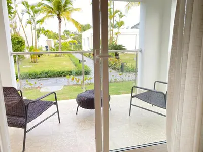 a balcony with a view of a yard at Apartamento de playa in San Felipe de Puerto Plata