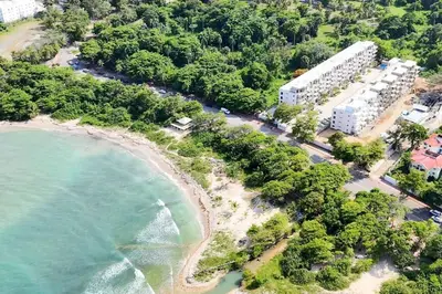 an aerial view of a beach with a resort at New Beachfront at Sunset Apartments 3 Bedroom 2 Bath Gym Pool PS5 in San Felipe de Puerto Plata