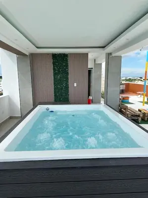 a large bath tub in a room with a patio at Apartamento santo domingo este in Juan López