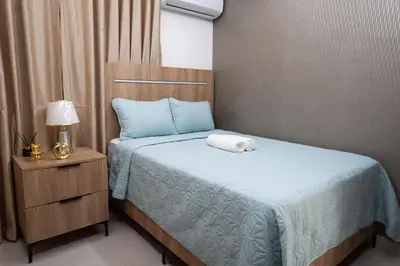 a bedroom with a bed with a towel on it at Apartamento en el gran santo Domingo in Santo Domingo
