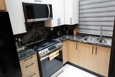 a kitchen with a stove and a sink at Apartamento en el gran santo Domingo in Santo Domingo