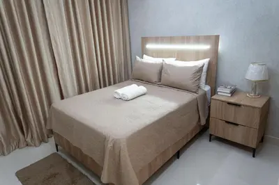 a bedroom with a bed with a white towel on it at Apartamento en el gran santo Domingo in Santo Domingo