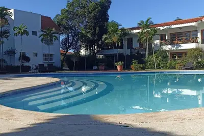 a swimming pool in front of a building at Apartamento Corozos 2-202 in Paraíso