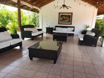 a living room with couches and tables on a patio at Apartamento Corozos 2-202 in Paraíso