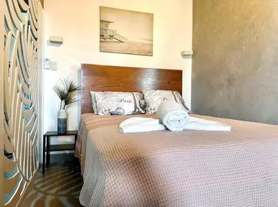 a bedroom with a bed with two towels on it at Luperon candles apartment in Puerto de Luperon