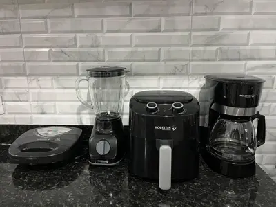 a blender and a toaster on a counter at Cozy Apartment in the heart of Santiago in Santiago de los Caballeros