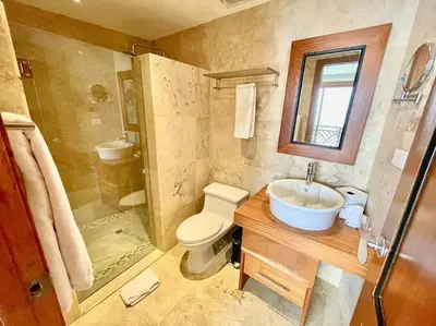 a bathroom with a toilet and a sink and a shower at Hotel en Samana con vista al Mar in Sabana