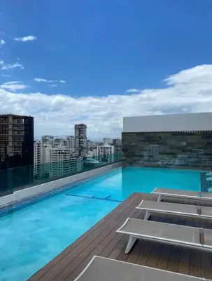 a swimming pool on the roof of a building at Arpel 6 SantoDomingo CItySeaView in Santo Domingo