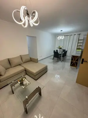 a living room with a couch and a table at RESIDENCIAL LEGADO Apto 1 A in Azua