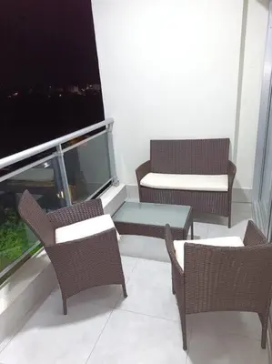 a room with chairs and a table and a window at Boca del Mar III, apto 706B in Boca Chica