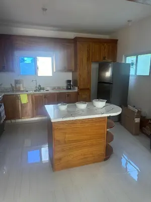 a kitchen with a island with three bowls on it at Villa familiar in San Felipe de Puerto Plata