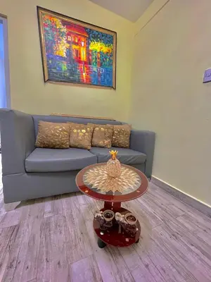 a living room with a couch and a table at Acogedor apartamento in Azua de Compostela