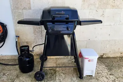 a grill sitting on a stand next to a wall at 1st Line view in San Pedro de Macorís