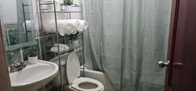 a bathroom with a toilet and a sink and a shower at Paraíso en Repúblico Dominicana in Santiago de los Caballeros