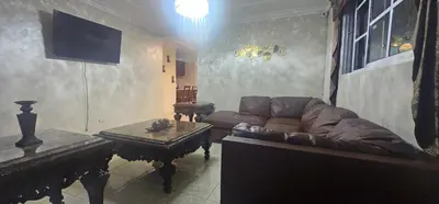 a living room with a couch and a table at Paraíso en Repúblico Dominicana in Santiago de los Caballeros