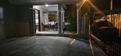 an entrance to a house with a gate and a porch at Paraíso en Repúblico Dominicana in Santiago de los Caballeros