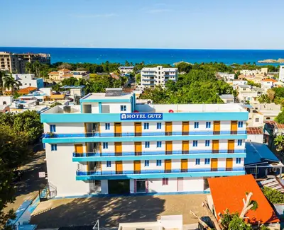 an aerial view of a building with the ocean in the background at Hotel Gutz in San Felipe de Puerto Plata