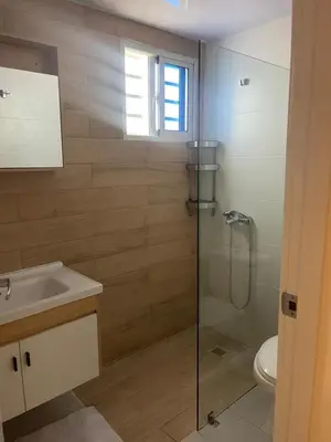 a bathroom with a shower and a sink and a toilet at Hermoso apto amueblado a 5 minutos de downtown Punta Cana in Punta Cana