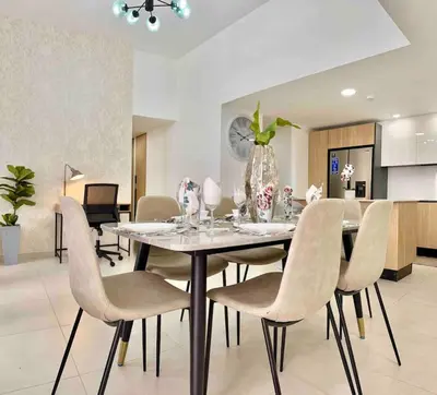 a dining room with a table and chairs at Comfy 2BR City Center Condo in Los Prados