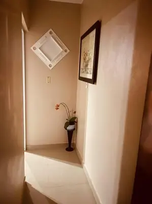 a hallway with a plant in a vase on a wall at Sábana de la mar in La Tentación
