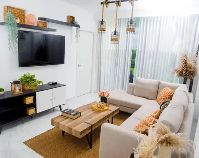 a living room with a couch and a table at The Peña family suite in Punta Cana