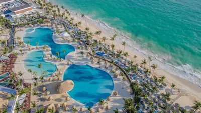 an aerial view of the pool and beach at a resort at Bahia Principe Grand Punta Cana - All Inclusive in Punta Cana