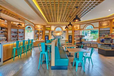 a restaurant with blue chairs and tables in it at Bahia Principe Luxury Ambar - Adults Only All Inclusive in Punta Cana