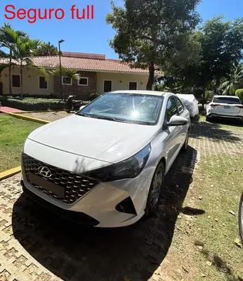 a white lexusuana parked in front of a house at Disfruta momentos inolvidables in Santo Domingo