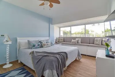 a bedroom with a bed and a couch at El Retiro Juan Dolio Beach by Elital Luxury in Villas del Mar