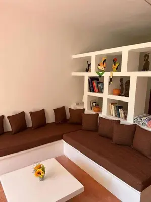 a living room with a couch and a table at Beach, nature and relaxation in Las Terrenas