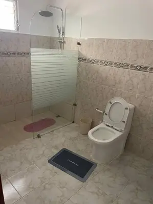 a bathroom with a toilet with a scale on the floor at cabrera villa con vista al mar in Cabrera