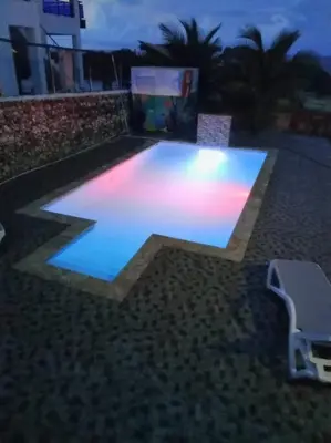 a minecraft pool with blue and pink lights at cabrera villa con vista al mar in Cabrera