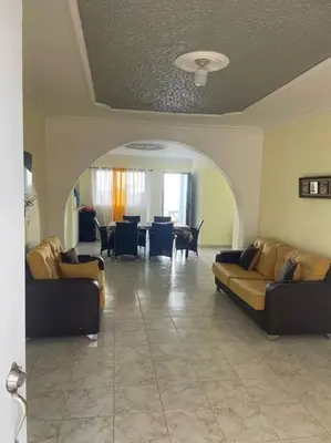 a living room with two couches and a table at cabrera villa con vista al mar in Cabrera