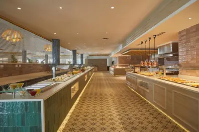 a restaurant with a buffet line with food at Bahia Principe Luxury Esmeralda All Inclusive - Newly Renovated in Punta Cana