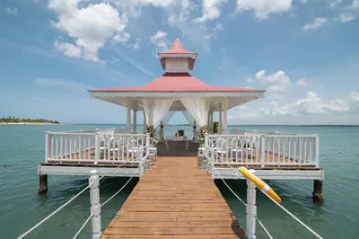 a pier with a gazebo on the water at Bahia Principe Luxury Bouganville - Adults Only All Inclusive in La Romana