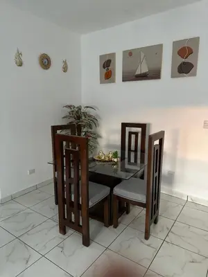 a dining room with a table and chairs at Apartamentos victoria in Las Terrenas