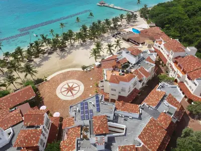 an aerial view of a house on the beach at Beach Day at CadaquesCaribe Bayahibe in Bayahibe
