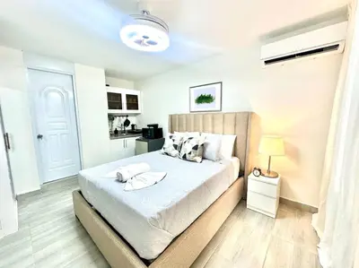 a bedroom with a large bed in a room at Villa Olímpica Doble Vía in Marilópez
