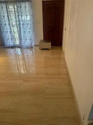 a room with a wooden floor and a door at Casa las Américas in La Alianza