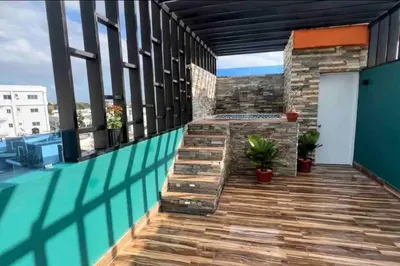 a balcony with a swimming pool on a building at Apartamento lujoso y cómodo in Santo Domingo