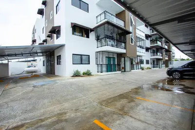 an empty parking lot in front of a building at APT 3 HAB Avenida España Piso 1 in La Viva