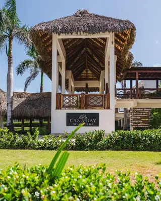 a pavilion with a sign in front of a resort at Melody 2BDR Condo with Pool View in Coral Bay #2 in Punta Cana