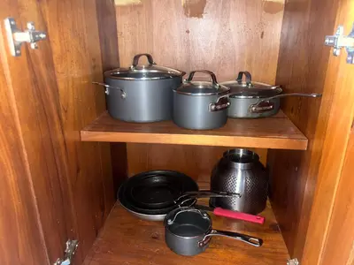 a group of pots and pans sitting on a shelf at Luxury Beach Penthouse with Pool, BBQ, AC, Wi-Fi, 5-Min Walk to El Cortecito & Bavaro Beaches, Punta Cana in Punta Cana