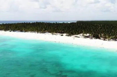 an aerial view of an island in the ocean at Brand New beach and golf condo in Punta Cana in Punta Cana