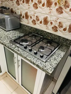 a stove top oven sitting on top of a kitchen counter at Apartamento Familiar in San Felipe de Puerto Plata