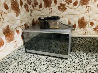 a glass cabinet sitting on top of a counter at Apartamento Familiar in San Felipe de Puerto Plata