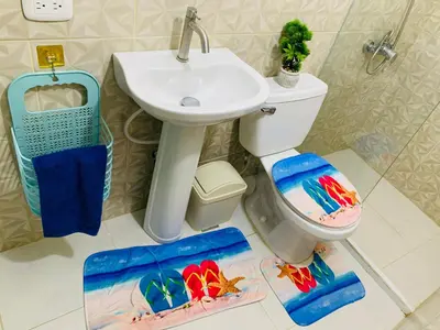 a bathroom with a sink and a toilet at Apartamento Familiar in San Felipe de Puerto Plata