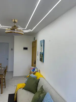 a living room with a couch and a ceiling at Tiny Home-El Pueblito in San Felipe de Puerto Plata