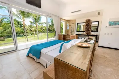 a bedroom with a bed and a large window at New private luxury villa in Punta Cana in Punta Cana